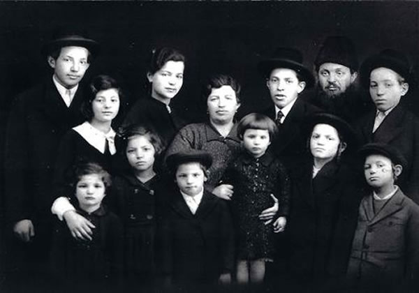 Amram Deutsch and family. Amram is in the bottom right-hand corner.