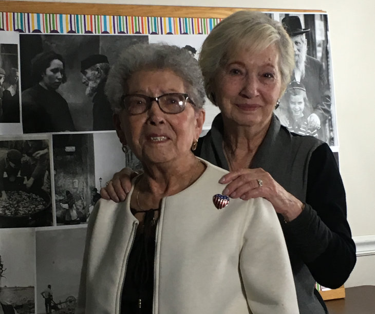 Sisters Anne Levy, left, and Lila Millen survived the Holocaust as hidden children in a wooden cabinet their father made.